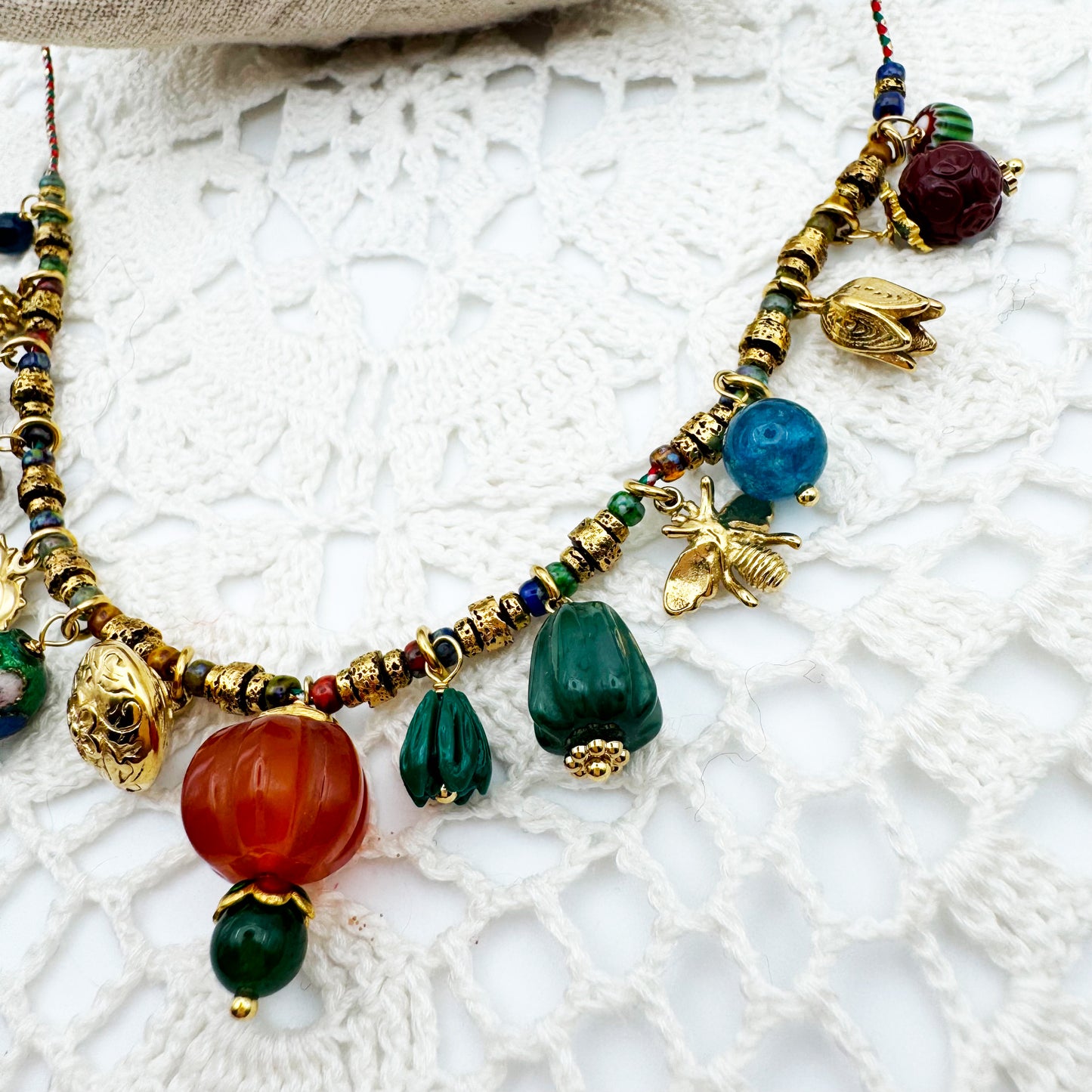 Collier Fil Rondelles pampilles citrouille sculptée