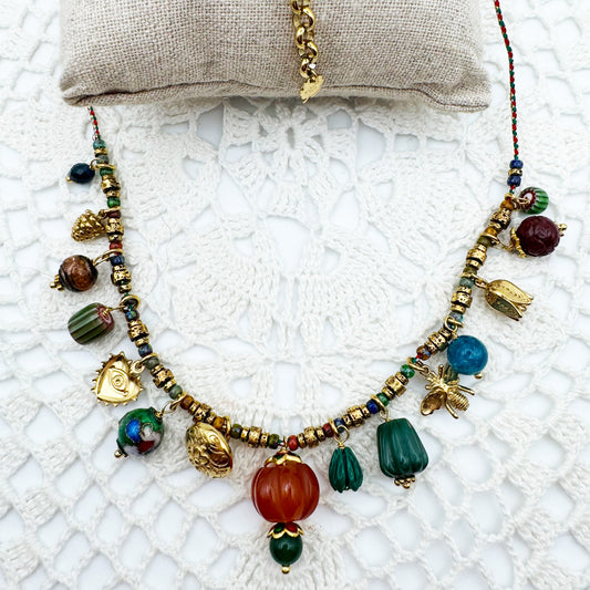 Collier Fil Rondelles pampilles citrouille sculptée